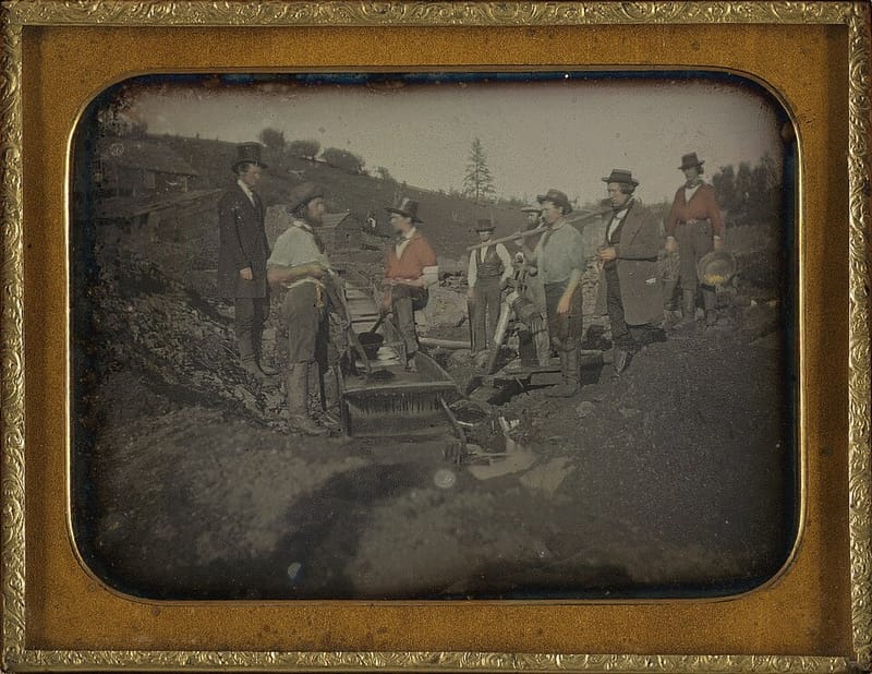 Daguerreotype of California gold miners working a long tom sluice, about 1850–1852