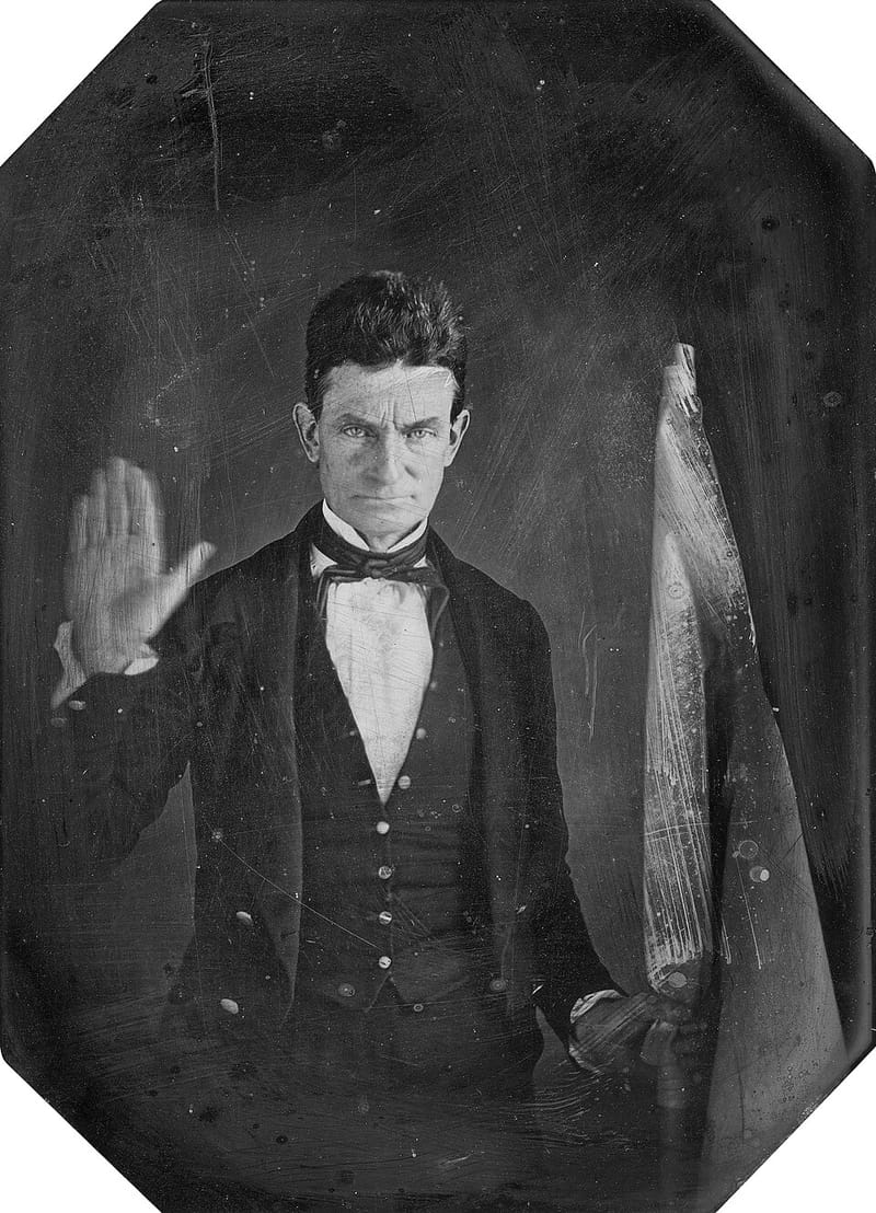 Daguerreotype of John Brown with his hand raised