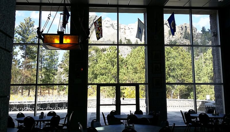 The carved faces of Washington, Jefferson, Theodore Roosevelt, and Lincoln on Mount Rushmore