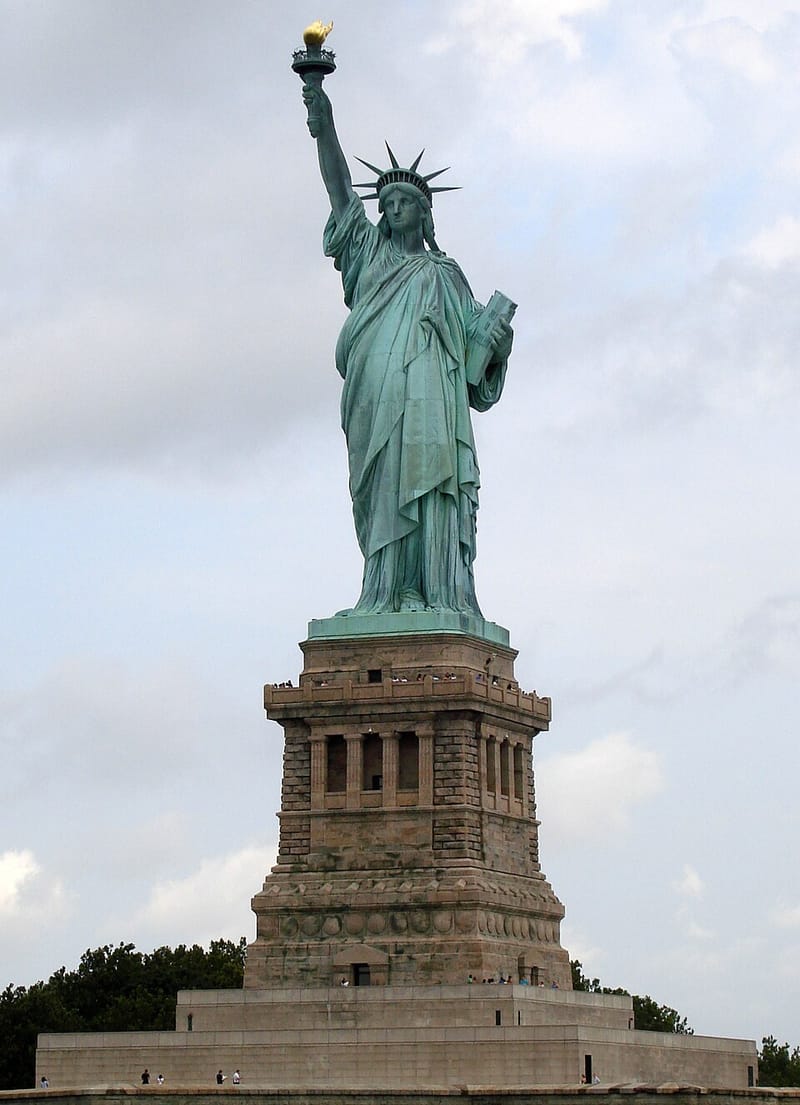 The Statue of Liberty on its pedestal, holding up her torch
